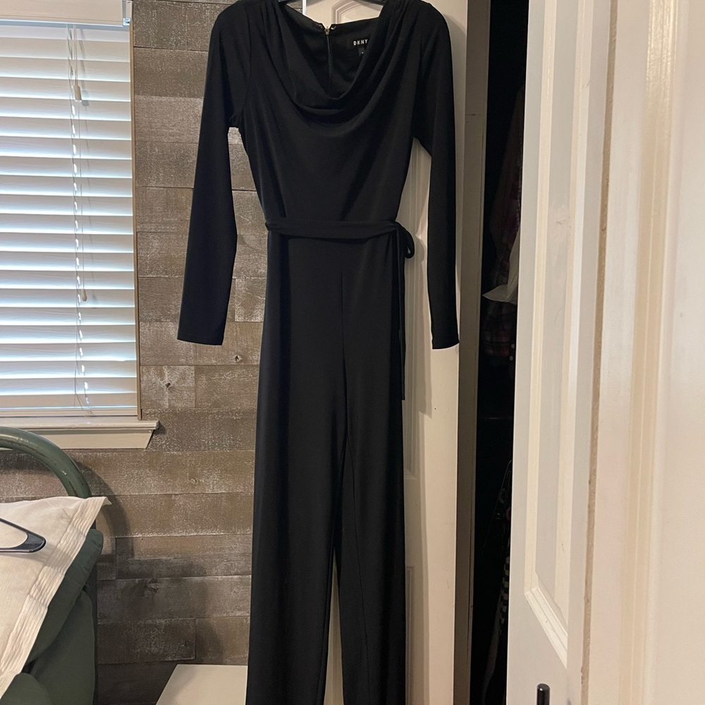 DKNY black jumpsuit. Worn only once. Beautiful collar and tie. Long sleeves